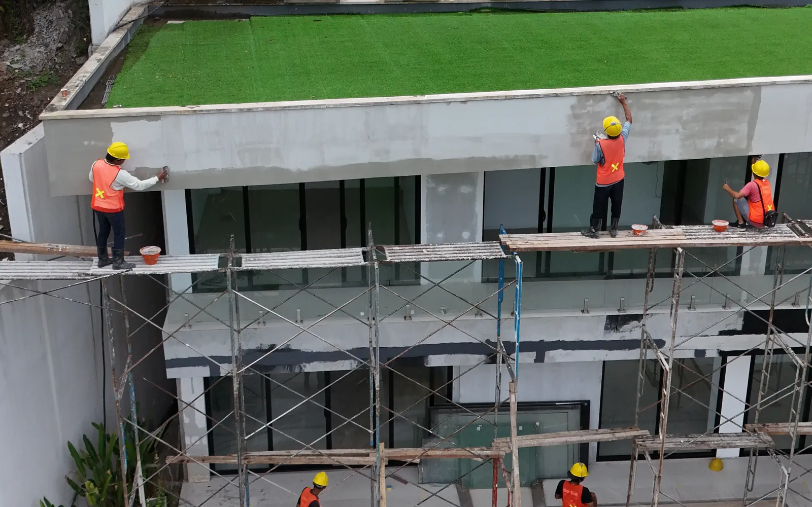 Facade work under way at Puri Sidem.