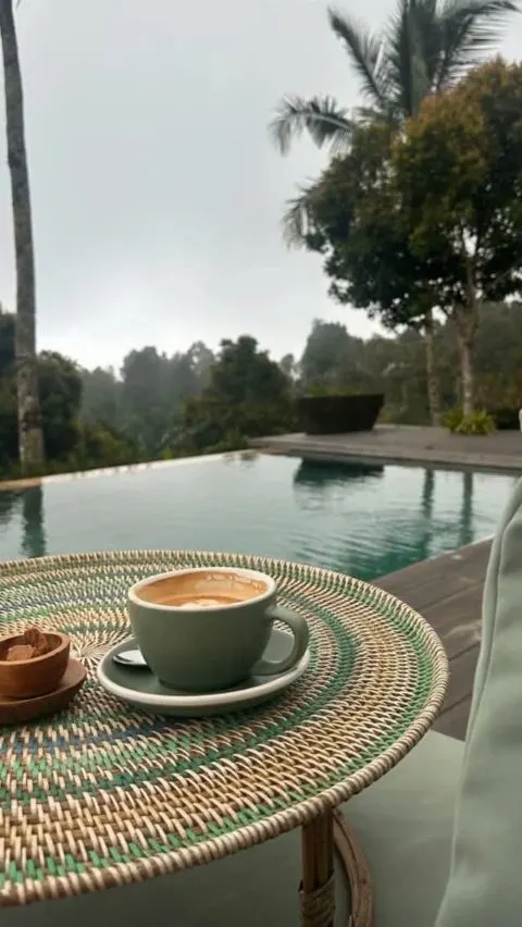 The pool holds the sky before the day begins.